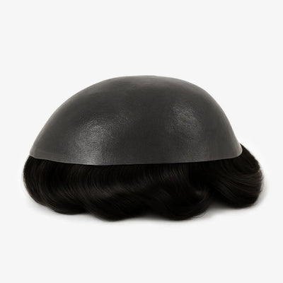 Toupet sur-mesure : calotte sombre et cheveux noirs ondulés